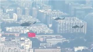 Military parade begins with helicopter formation