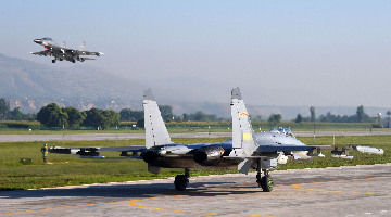 J-11 fighter jets execute combat training
