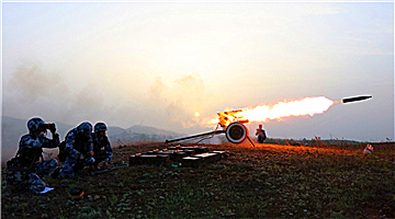 Artillerymen fire Type 87 twin-25mm towed anti-aircraft artillery system