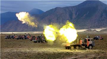 Artillerymen fire PCL-09 122mm self-propelled howitzer systems