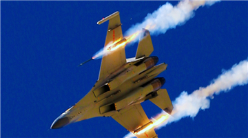 J-11 fighter jet fires at ground targets