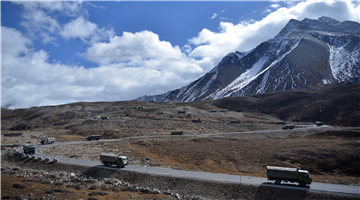 Military trucks move on Sichuan-Xizang Highway for transport mission