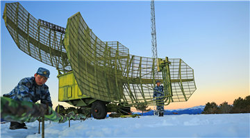 Soldiers check radar systems after heavy snow