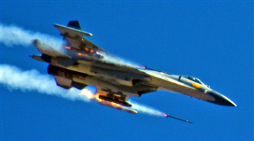 Fighter jets fire rockets at ground targets