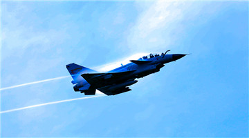Ground crew signals fighter jet in real combat flight