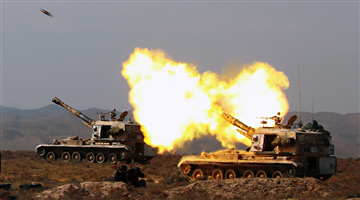 Gun-howitzer systems spit fires