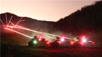 Tanks spit fires at night
