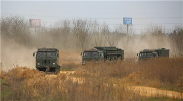 Armored vehicles en route to training area