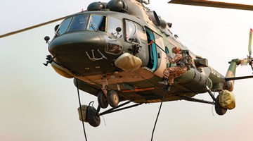 Soldiers fast-rope from transport helicopters