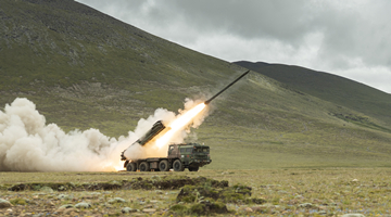 Long-range Multiple Launch Rocket Systems conduct salvo of shells