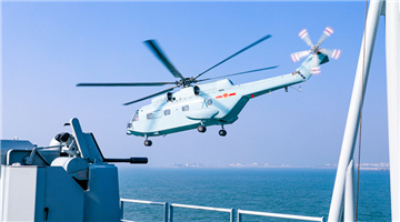 Ship-borne helicopter lands on supply ship Dongpinghu (Hull 902)
