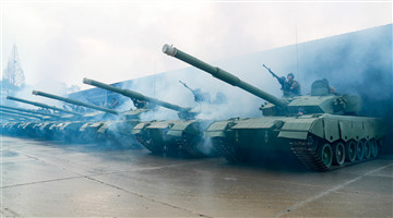 Soldiers maneuver main battle tanks to training field