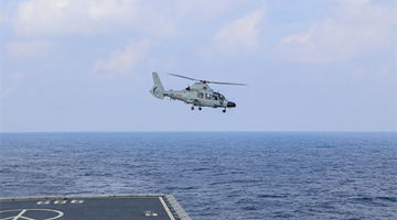 Ship-borne helicopter takes off during flight training