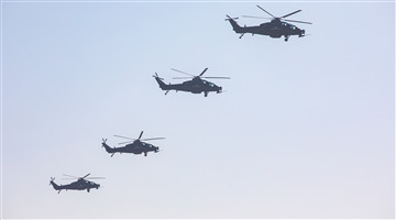 Attack helicopters fly in formation
