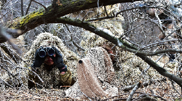 Soldiers engage mock targets in Ghillie suits