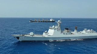 Chinese naval taskforce escorts merchant ships in a row