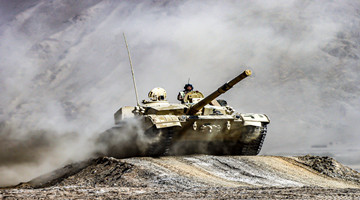 MBTs rumble through smoke and dust