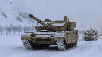 Main battle tanks rumble through snowfield