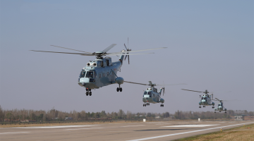 Helicopters participate in round-the-clock flight training